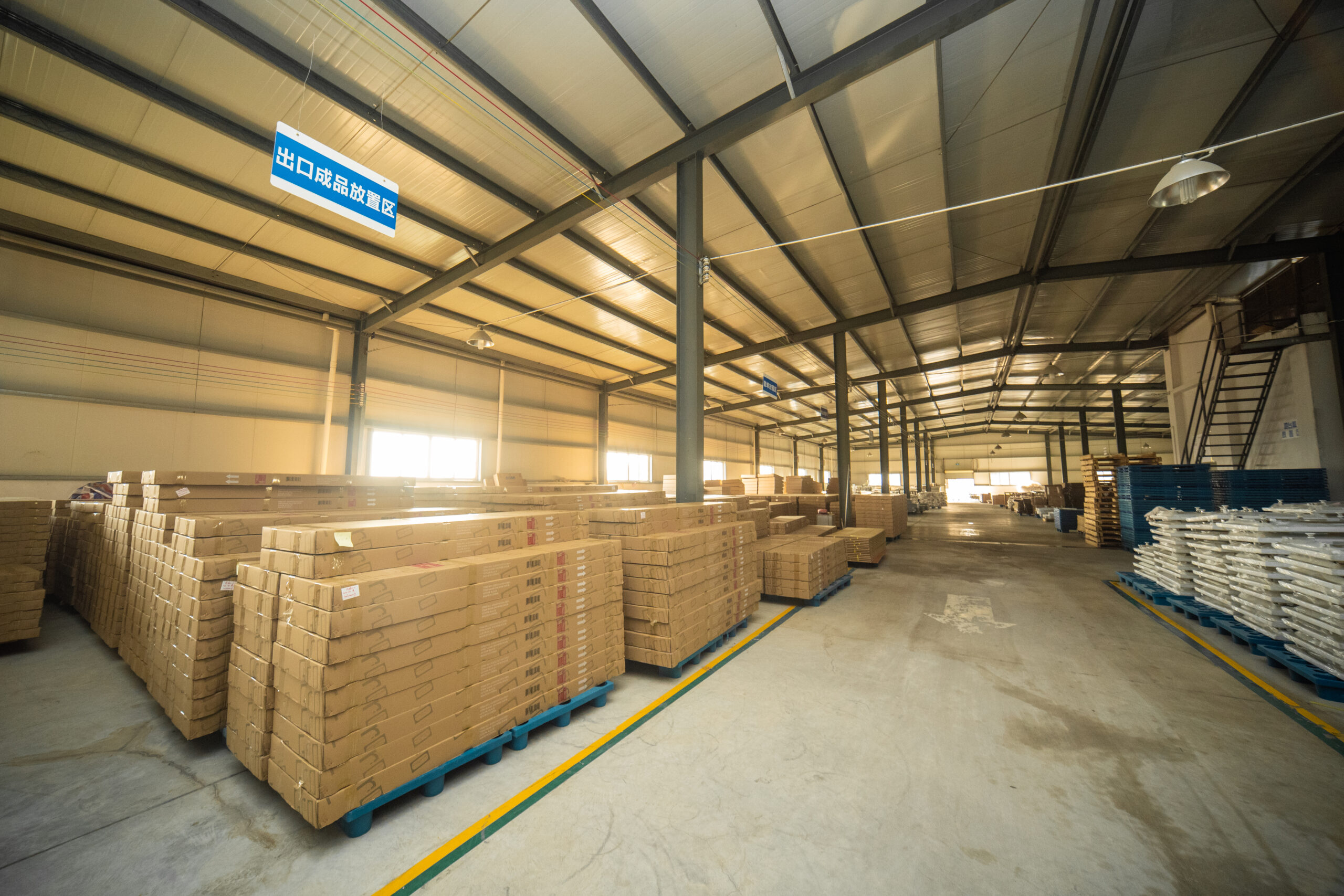 KJbath finished goods storage area with stacked packaged orders ready for export