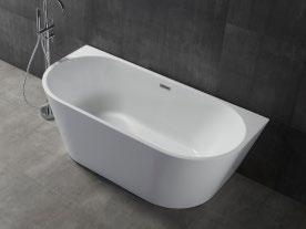 White back-to-wall freestanding acrylic bathtub CC546 against a dark gray textured wall with chrome shower fixture