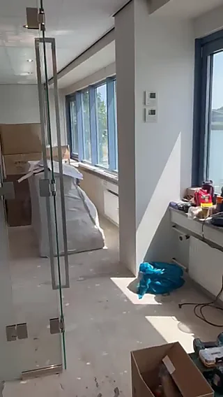 Installed glass office door and full-height window wall at the Dar es Salaam office building project, Tanzania