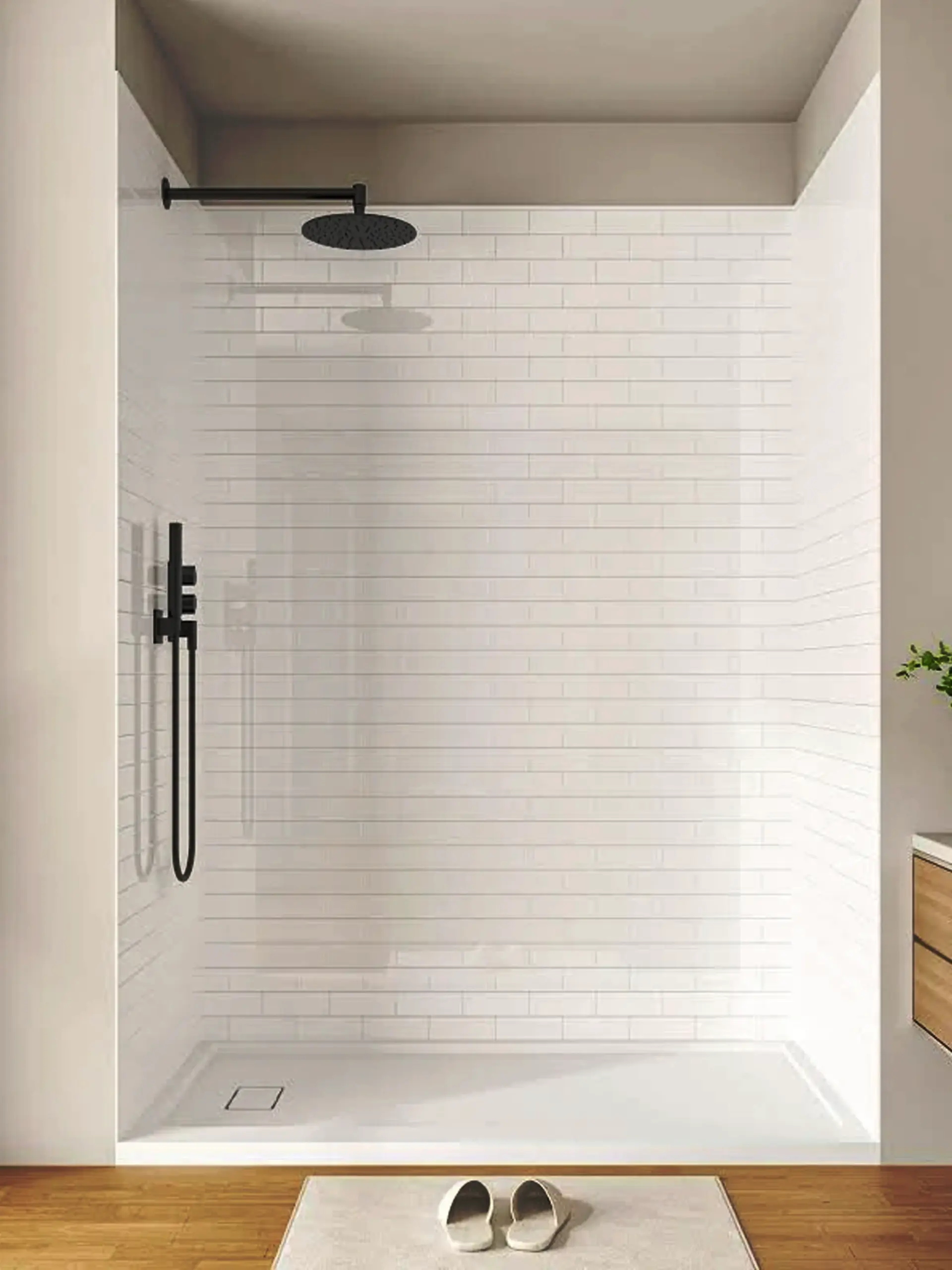 Frameless glass shower door with slim metal frame beside a white vanity and LED mirror in a modern gray-tiled bathroom